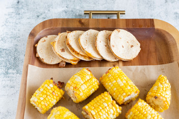mini tacos, quesadillas, and corn on the cob, wooden tray, finger foods, kids dinner