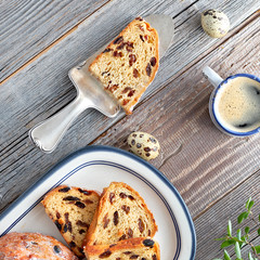Easter Bread (Osterbrot in German). Top view of traditional fruity bread on rustic wood  with fresh...