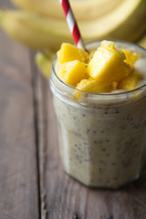 Beautiful and tasty dessert with mango and seeds of a chia. A fresh pudding with fruit for breakfast