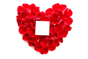 Beautiful heart of red rose petals with blank paper
