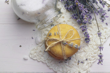 Tasty homemade lavender cookies on light wooden background