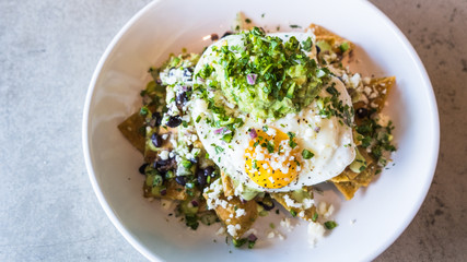 Chilaquiles with eggs and guacamole
