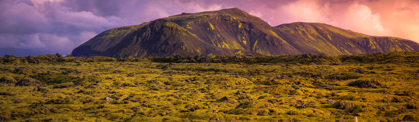 Typical landscape of the spectacular moss fields of Eldhraun moss covering lava rock) in the south of Iceland. Dramatic sky