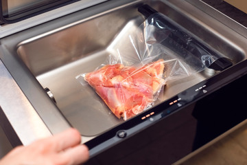 raw meat in a vacuum package. Vacuuming meat in a vacuum