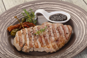 Grilled pork steak with pepper sauce