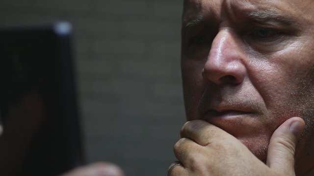 Worried Businessman Image in Darkness Using Smartphone Wireless Communication