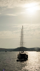Silhouette of a yacht in the Bay.