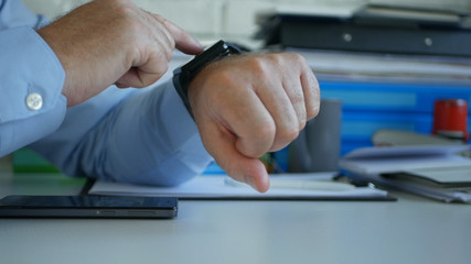 Businessman at Workplace Check Time and Phone Messages Using His Smartwatch