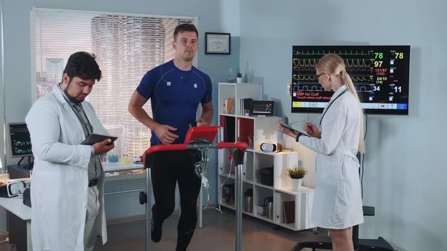 Exhausted athlete suddenly interrupt treadmill test because of feeling bad. Doctors at that time have recorded his EKG data. In Scientific Sports Laboratory.