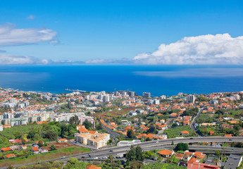 Fototapeta na wymiar Funchal and Atlantic ocean panormic view from The Pico dos Barcelos Viewpoin (MIRADOURO PICO DOS BARCELOS) in Funchal city, Madeira island, Portugal in summer sunny day 