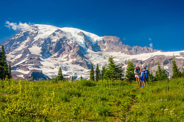 Fototapeta na wymiar Four children posing for the camera with Mt. Rainier in the background.