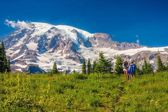 Four children posing for the camera with Mt. Rainier in the background.