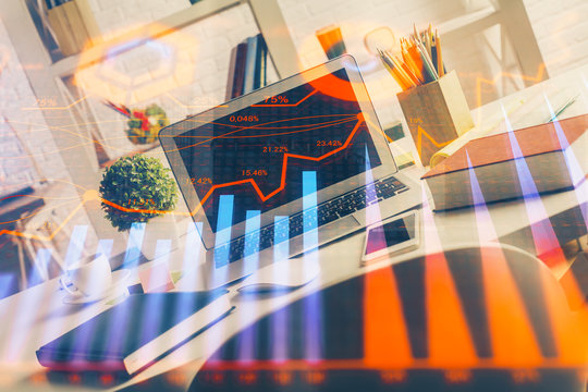 Financial graph colorful drawing and table with computer on background. Double exposure. Concept of international markets.