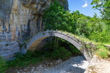 Fototapeta na wymiar Stone bridge of Kontodimos or Lazaridis, in Zagori region, Epirus, Greece.