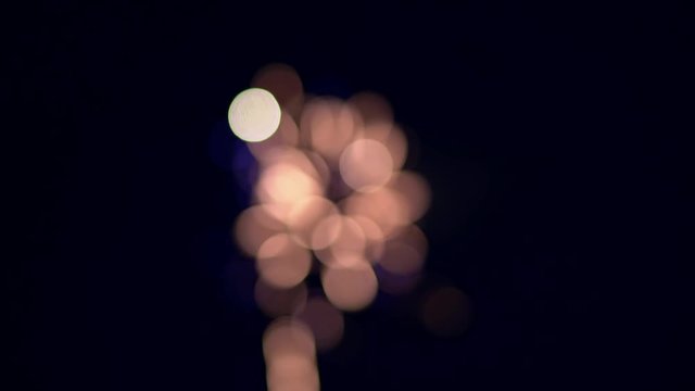 Fireworks lighting up the sky with blurred particles festive in ball shape