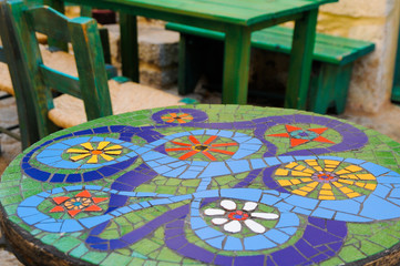 table with mosaic on a garden
