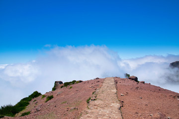 Landscape of hiking trail from Pico do Arieiro to Pico Ruivo, Madeira island, Portugal in summy summer day above the clouds