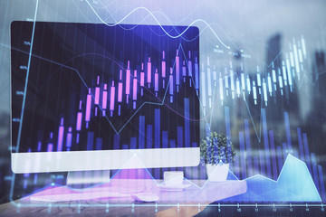 Financial market graph hologram and personal computer on background. Double exposure. Concept of forex.