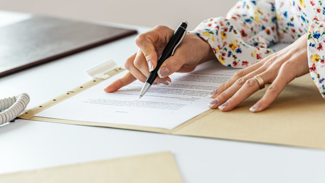 Businesswoman proofreading a contract