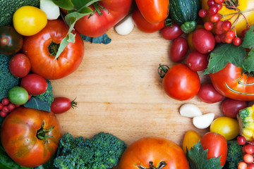 Tomatoes, zucchini, cucumbers, garlic and broccoli on the table - flat lay