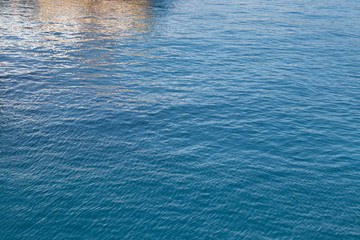 Bluewater of the sea, reflected. Background of abstract seawater in Italy. Azure color. Summer background.