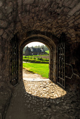 Balvenie Castle entrance with stone floor and green field in the background, Dufftown, Scotland, UK