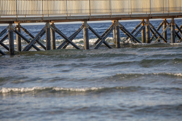 Wooden pier on the sea summer background