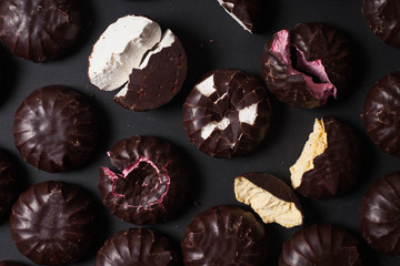 Background from marshmallows. Broken, cut, cracked, whole