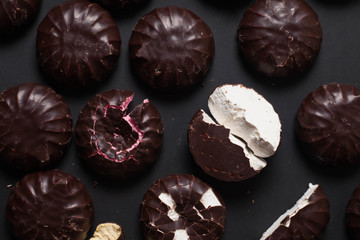 Background from marshmallows. Broken, cut, cracked, whole