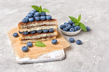 Sandwiches with chocolate spread, pine nuts and blueberries