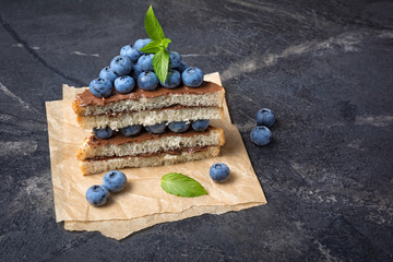 Sandwiches with chocolate spread, pine nuts and blueberries