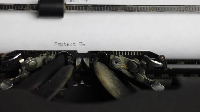 Typing Contact Us on vintage typewriter with sound.