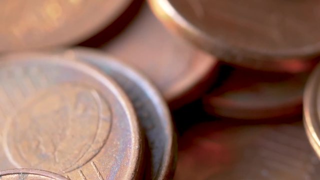 Close-up of A Rotating Heap of Dusty And Dirty Bronze Euro Coins, Selected Focus, Blurry Background