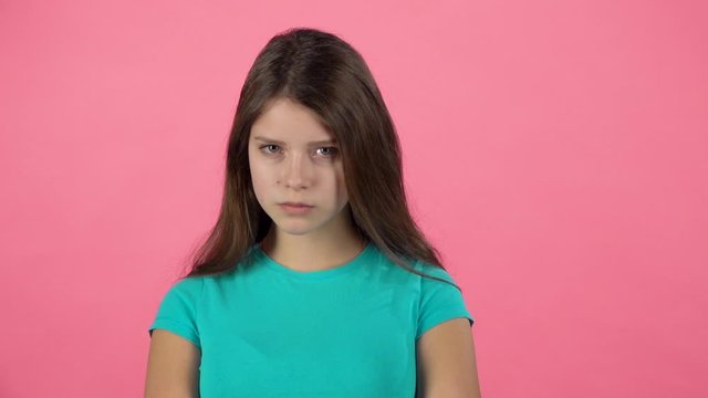 Cute female is changing her mood. Firtly she is angree disagree and then happy. Slow motion