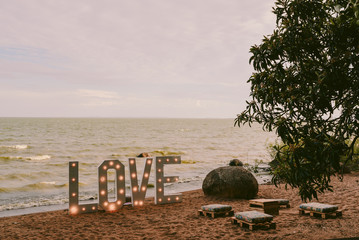 Fototapeta na wymiar love and bench on the beach