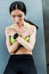 overhead view of attractive girl doing do abs on fitness mat