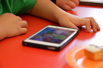 A child and a mobile phone