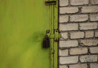 bright green door with an old lock