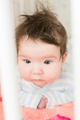 surprised child. surprised kid sitting at table. child's eyes widened and mouth opened in amazement. copy space for your text