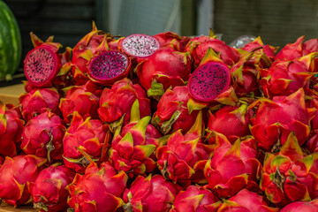 Pitahaya tropic red fruit on open air market counter 