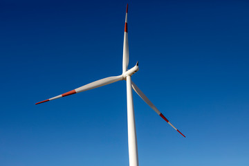Wind turbine isolated on blue sky