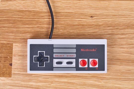 BUDAPEST, HUNGARY - DECEMBER 10, 2017: Nintendo NES classic controller on a table. One of the most classic gaming consoles