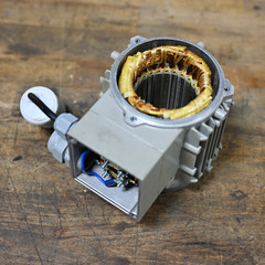 Exposed part of electric motor with stator exposed.