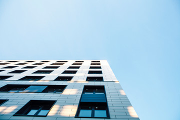 view on new modern buildings, facade corner and sky, real houses on line