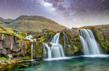 Famous travel location in Iceland. Kirkjufell Waterfalls at night, long exposure