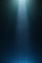A dark blue gradient background into a black dot is lit from above in light blue light