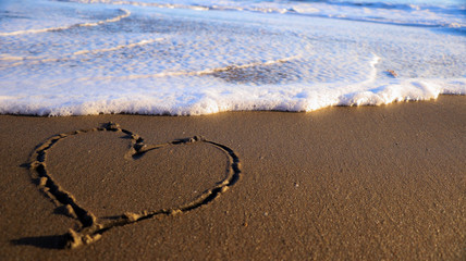 Fototapeta na wymiar Heart In the sand