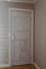 Wief of white interior door primed with white color before to be painted. Painting concept. 