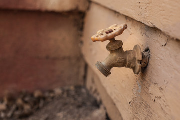 metal brown water faucet outdoor