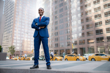 Powerful stance portrait of a successful and accomplished African American CEO businessman, in...